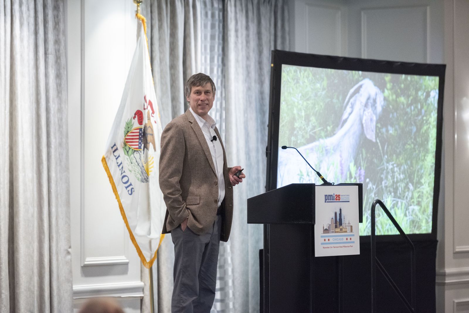 Justin Brown speaking at podium